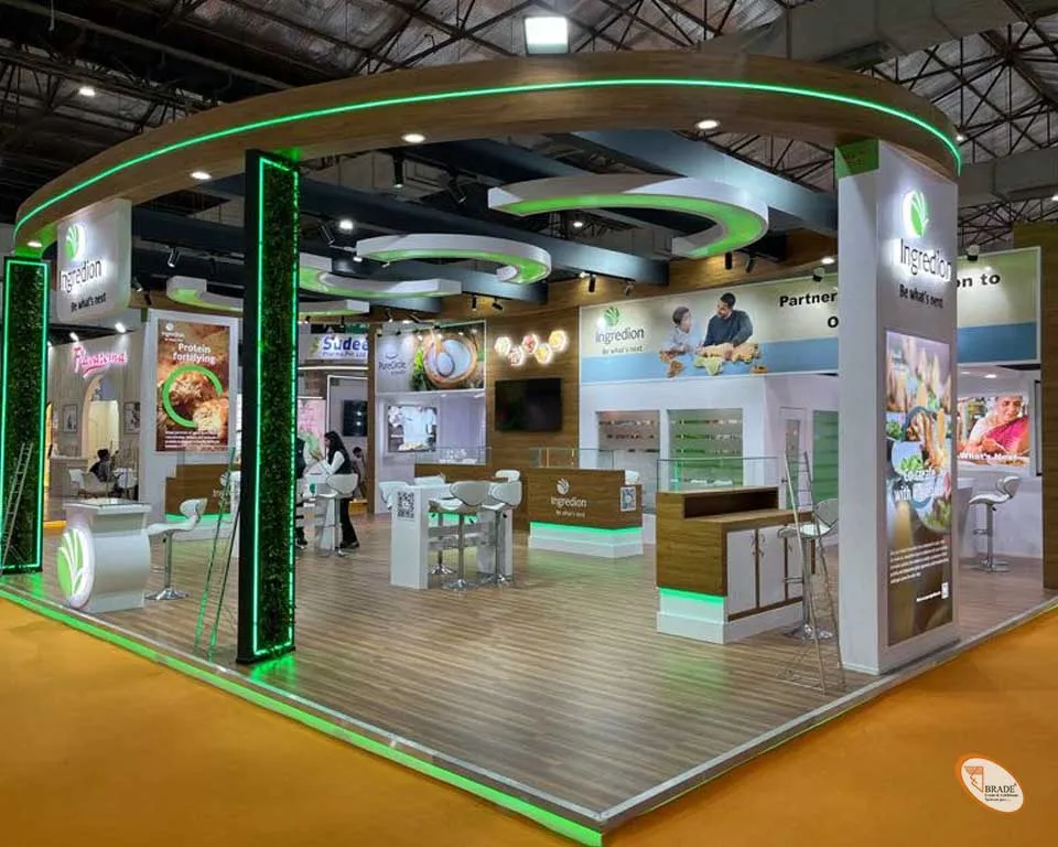 Spacious exhibition stand with large branding and visitor seating area